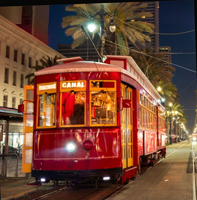 A streetcar called 'Canal' moves through a crowded street.